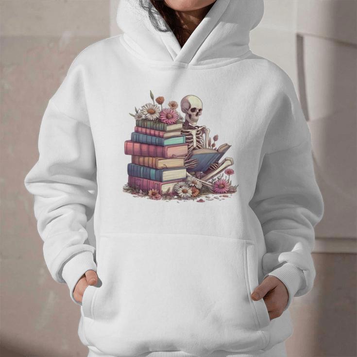 Reading A Book Per Day Keeps Reality Away Skeleton Books Graphic Youth Hoodie
