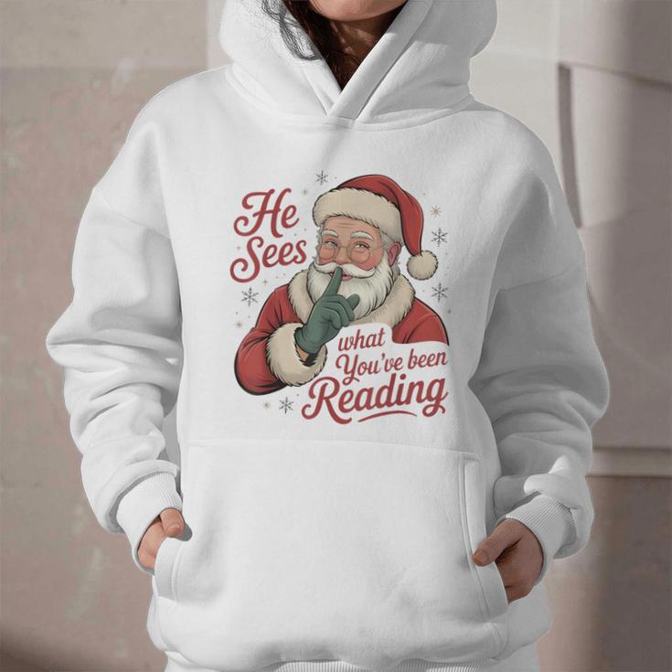 He Sees What You'Ve Been Reading Bookish Christmas Humor Graphic Youth Hoodie He Sees What You'Ve Been Reading Bookish Christmas Humor Graphic Youth Hoodie