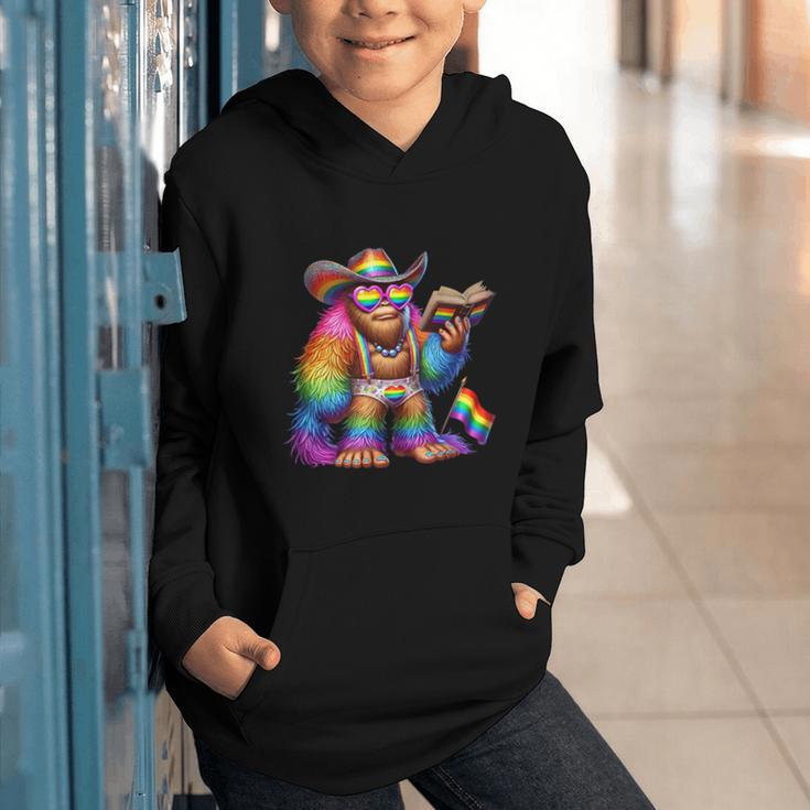 Rainbow Pride Bigfoot Reading Book With Heart Glasses Graphic Youth Hoodie