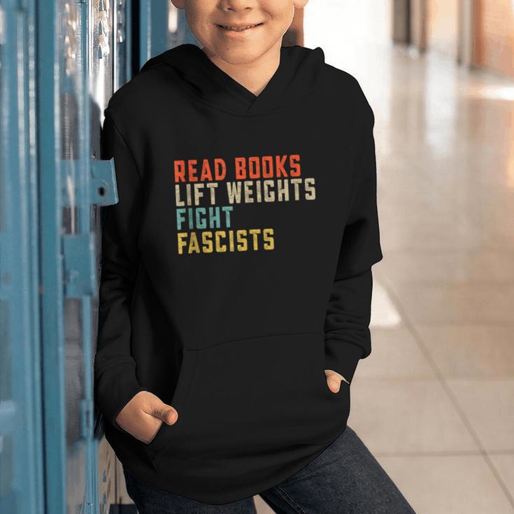 Read Books Lift Weights Fight Fascists Reading Graphic Youth Hoodie Read Books Lift Weights Fight Fascists Reading Graphic Youth Hoodie