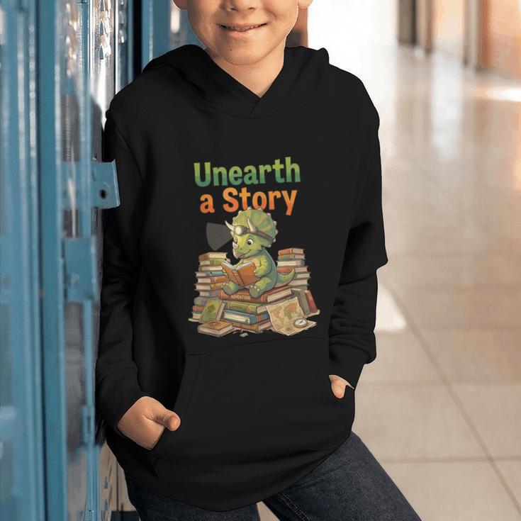 Unearth a Story Triceratops Dinosaur Reading Books Cute Dino Graphic Youth Hoodie Unearth a Story Triceratops Dinosaur Reading Books Cute Dino Graphic Youth Hoodie