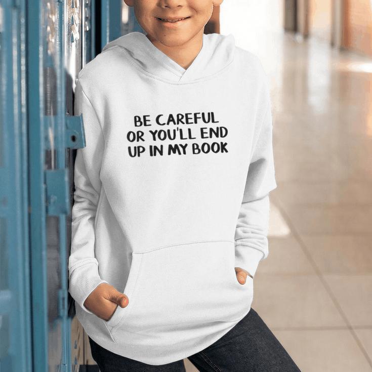 Be Careful Or You’Ll End Up In My Book Graphic Youth Hoodie