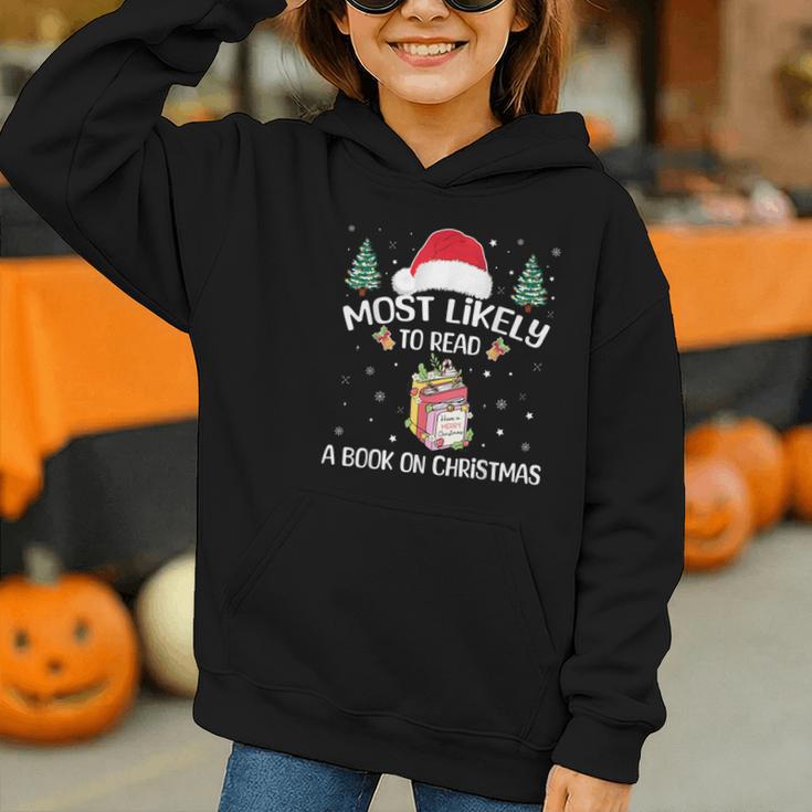 Most Likely To Read A Book On Christmas Love Reading Books Graphic Youth Hoodie Most Likely To Read A Book On Christmas Love Reading Books Graphic Youth Hoodie