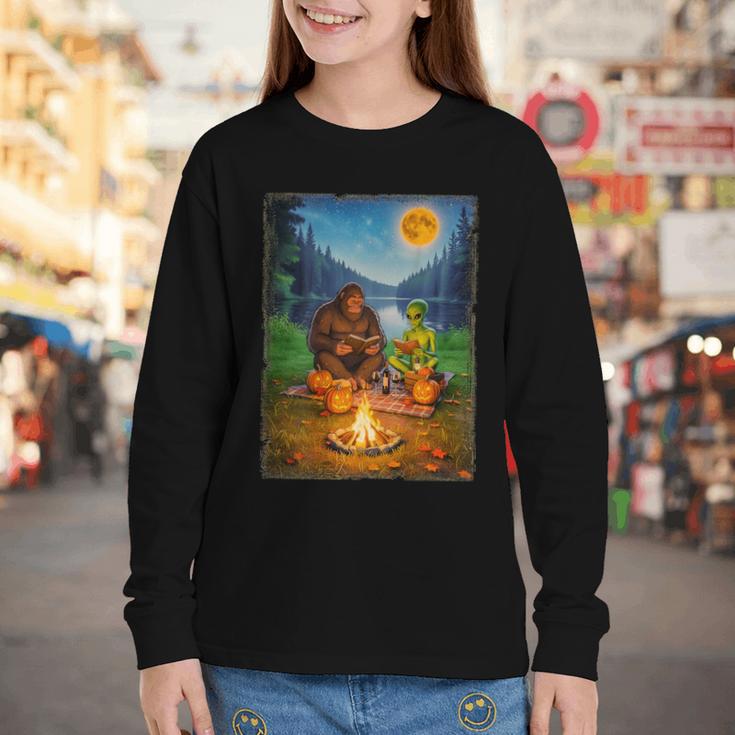 Bigfoot And Alien Reading Books Campfire Halloween Youth Long Sleeve Tee