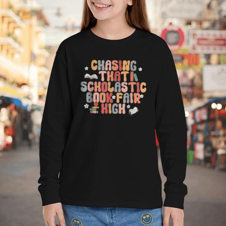 CHASING THAT SCHOLASTIC BOOK FAIR HIGH Youth Long Sleeve Tee