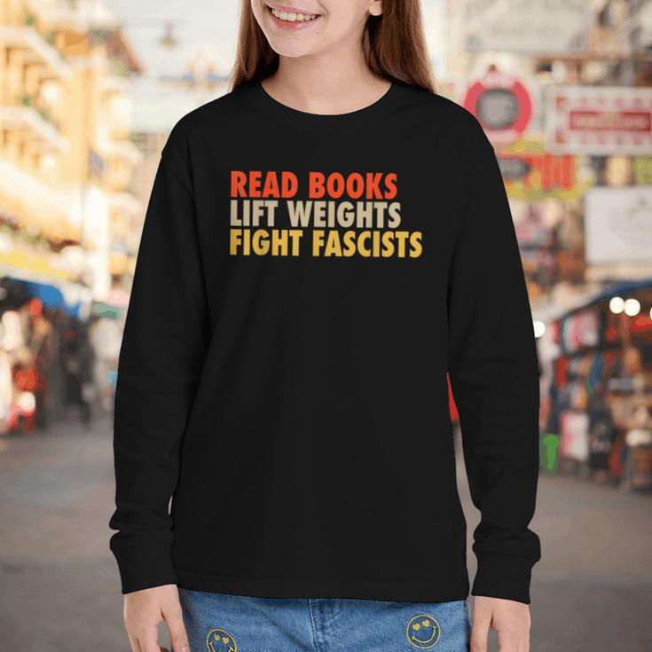 Read Books Lift Weights Fight Fascists Reading Humor Youth Long Sleeve Tee Read Books Lift Weights Fight Fascists Reading Humor Youth Long Sleeve Tee