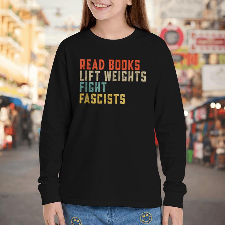 Read Books Lift Weights Fight Fascists Reading Youth Long Sleeve Tee Read Books Lift Weights Fight Fascists Reading Youth Long Sleeve Tee