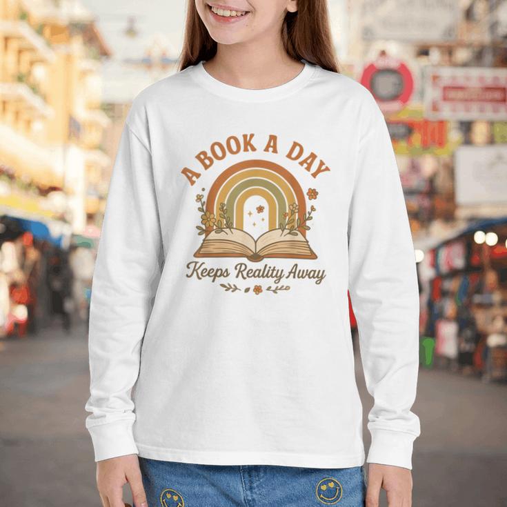 A Book A Day Keeps Reality Away Reading Youth Long Sleeve Tee A Book A Day Keeps Reality Away Reading Youth Long Sleeve Tee