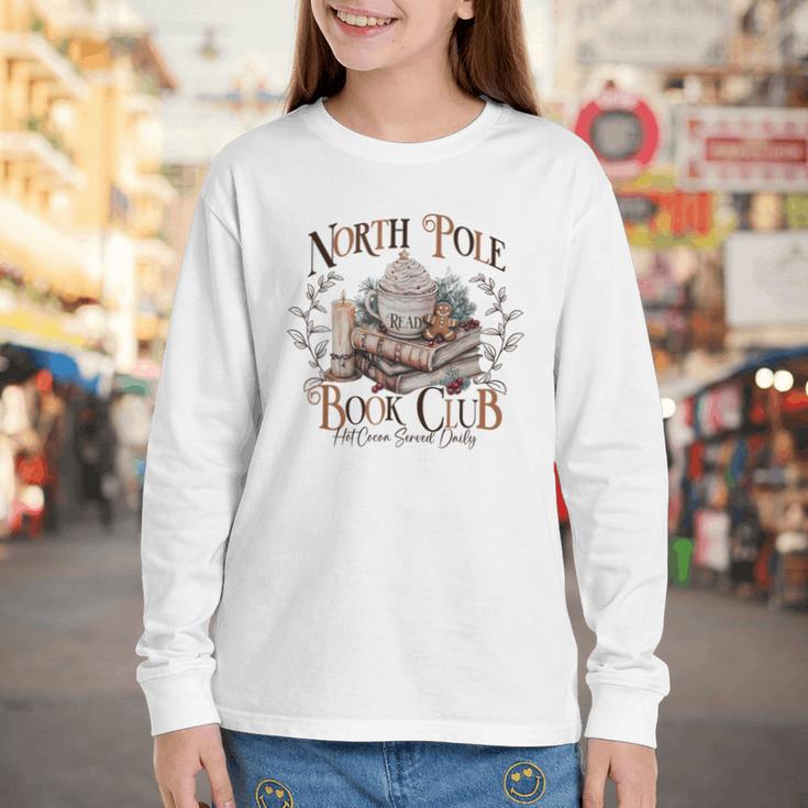 North Pole Book-Club Hot Cocoa Served Daily Christmas Book Youth Long Sleeve Tee North Pole Book-Club Hot Cocoa Served Daily Christmas Book Youth Long Sleeve Tee