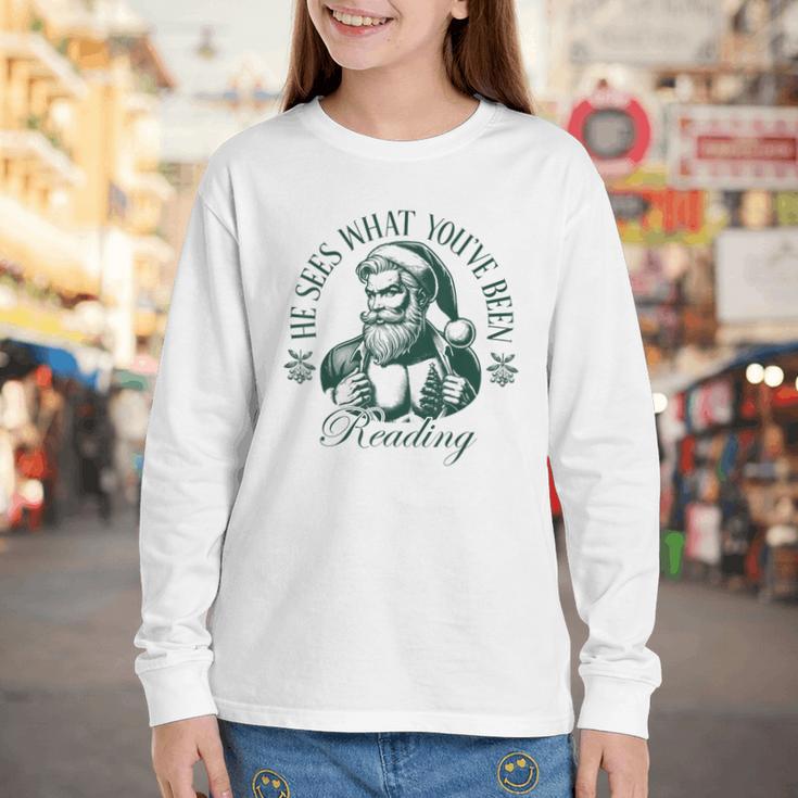 He Sees What You'Ve Been Reading Bookish Christmas Youth Long Sleeve Tee He Sees What You'Ve Been Reading Bookish Christmas Youth Long Sleeve Tee