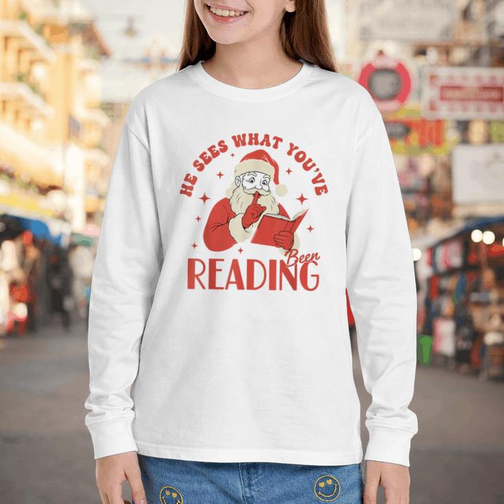 He Sees What You'Ve Been Reading Santa Book Youth Long Sleeve Tee