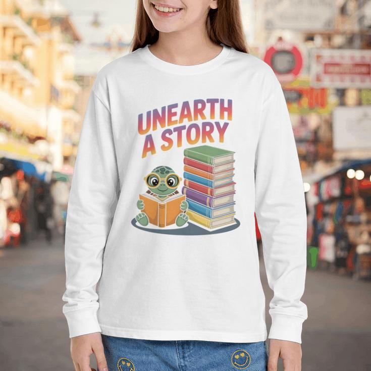 Unearth A Story Cute Turtle Reading Books Librarian Youth Long Sleeve Tee