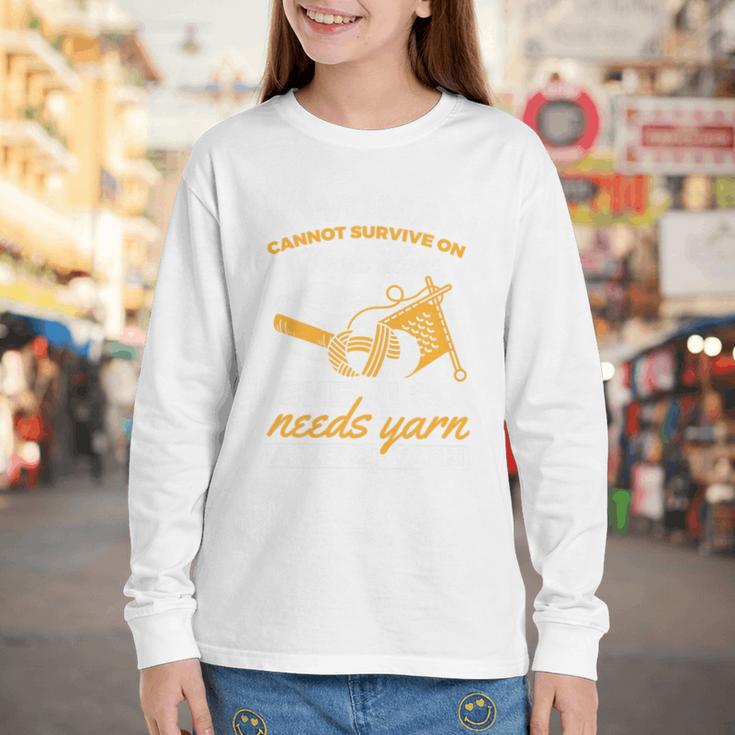 Woman Survives On Books Yarn Knitting Crochet Premium Tri-Blend Youth Long Sleeve Tee Woman Survives On Books Yarn Knitting Crochet Premium Tri-Blend Youth Long Sleeve Tee