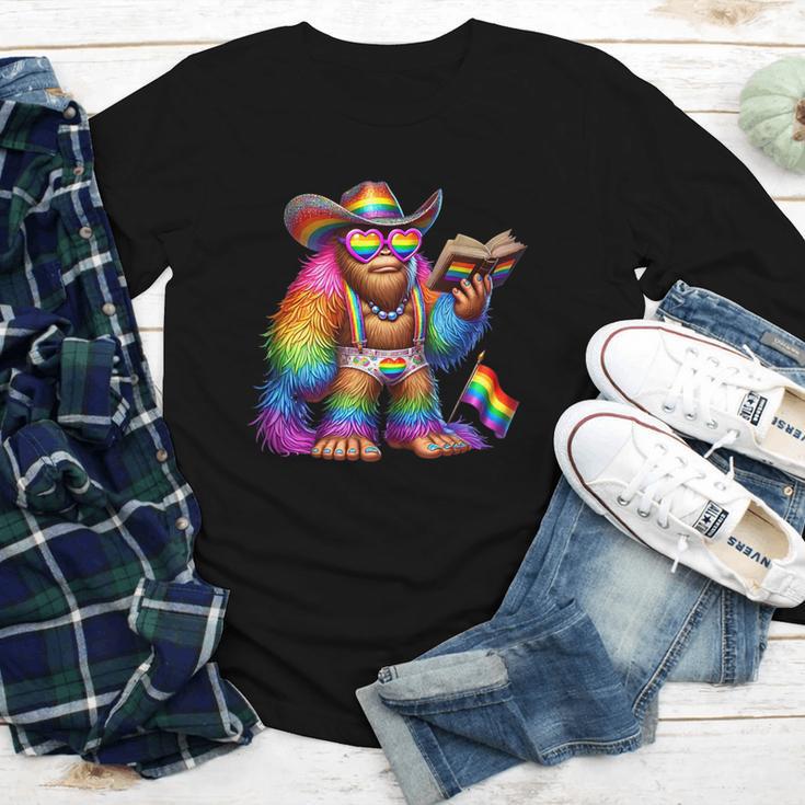 Rainbow Pride Bigfoot Reading Book With Heart Glasses Youth Long Sleeve Tee Rainbow Pride Bigfoot Reading Book With Heart Glasses Youth Long Sleeve Tee