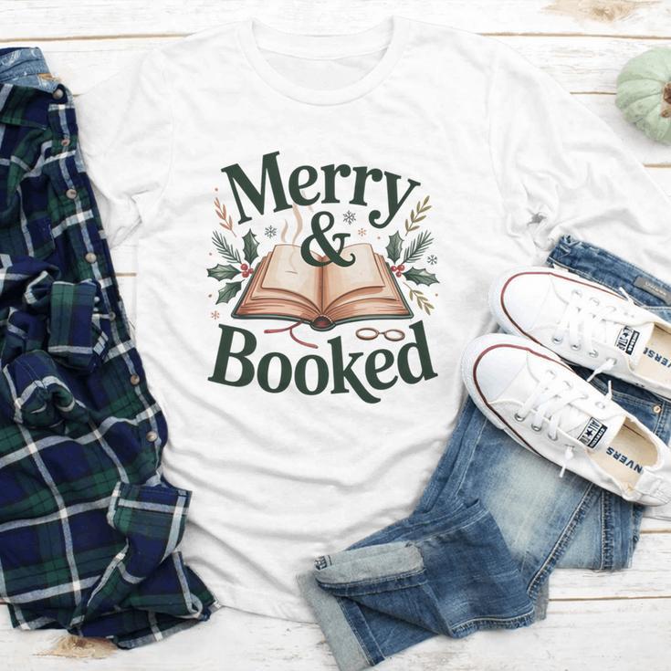 Merry And Booked Holiday Reading Winter Book Lover Premium Tri-Blend Youth Long Sleeve Tee Merry And Booked Holiday Reading Winter Book Lover Premium Tri-Blend Youth Long Sleeve Tee