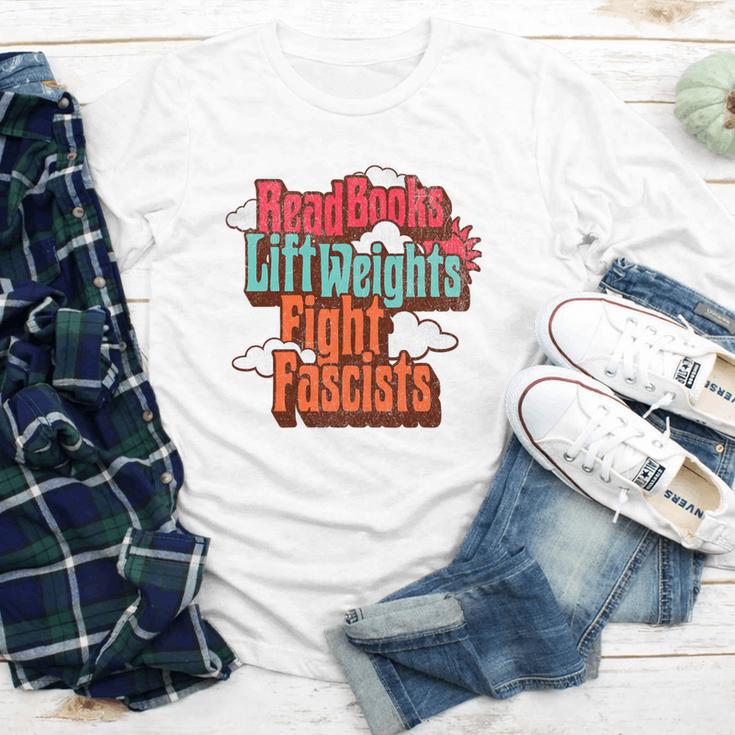 Read Books Lift Weights Fight Fascists Reading No Kings Premium Tri-Blend Youth Long Sleeve Tee Read Books Lift Weights Fight Fascists Reading No Kings Premium Tri-Blend Youth Long Sleeve Tee