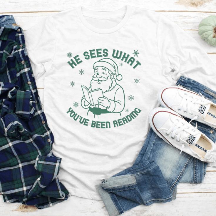 He Sees What You'Ve Been Reading Christmas Bookish Santa Premium Tri-Blend Youth Long Sleeve Tee He Sees What You'Ve Been Reading Christmas Bookish Santa Premium Tri-Blend Youth Long Sleeve Tee