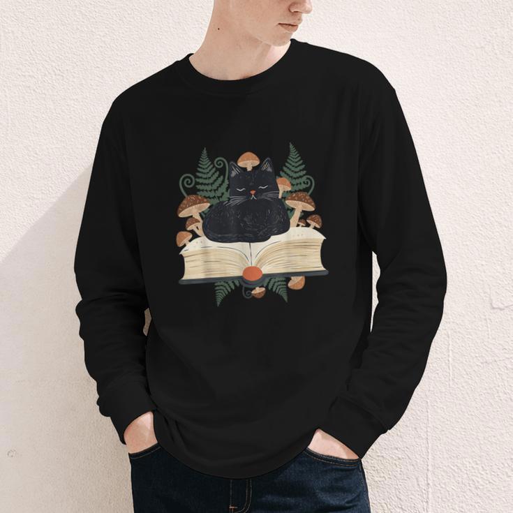 Cat On Open Book Mushrooms Ferns Dark Academia Youth Long Sleeve Tee Cat On Open Book Mushrooms Ferns Dark Academia Youth Long Sleeve Tee