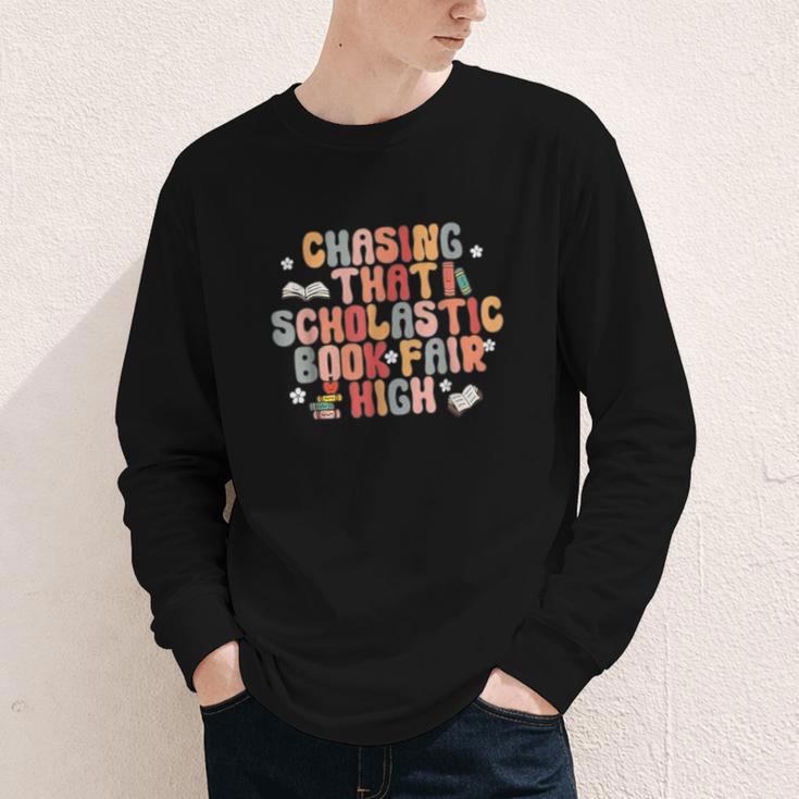 CHASING THAT SCHOLASTIC BOOK FAIR HIGH Youth Long Sleeve Tee