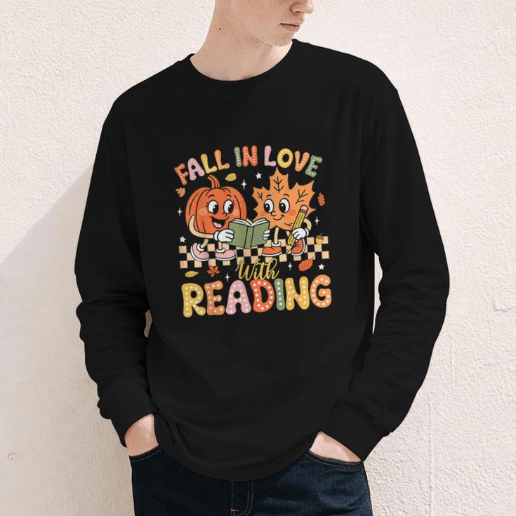 Fall In Love With Reading Autumn Pumpkin Teacher Book Lover Youth Long Sleeve Tee