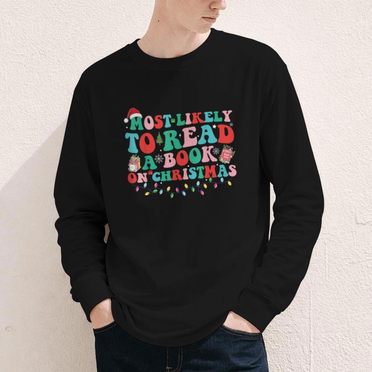 Groovy Christmas Most Likely To Read A Book On Christmas Youth Long Sleeve Tee