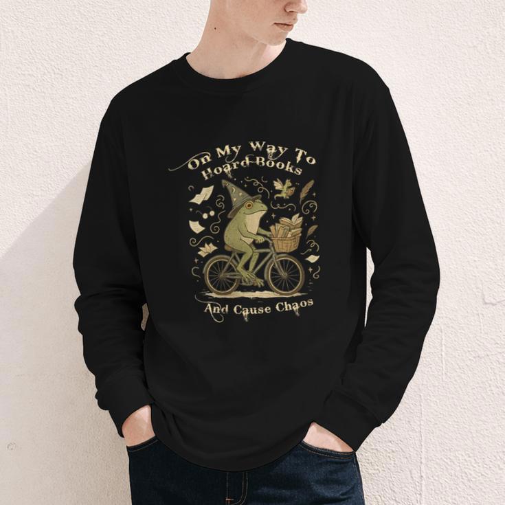 On My Way To Hoard Books And Cause Chaos Tom Foolery Frog Youth Long Sleeve Tee On My Way To Hoard Books And Cause Chaos Tom Foolery Frog Youth Long Sleeve Tee