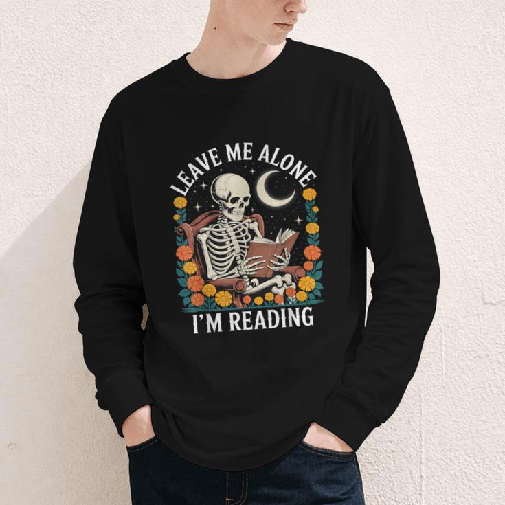 Leave Me Alone Skeleton Reading Book Floral Moon Librarian Youth Long Sleeve Tee Leave Me Alone Skeleton Reading Book Floral Moon Librarian Youth Long Sleeve Tee