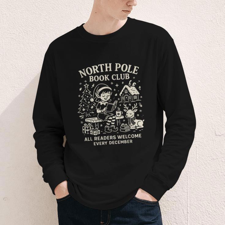 North Pole Book Club Christmas Elf Bookish Retro Graphic Youth Long Sleeve Tee North Pole Book Club Christmas Elf Bookish Retro Graphic Youth Long Sleeve Tee