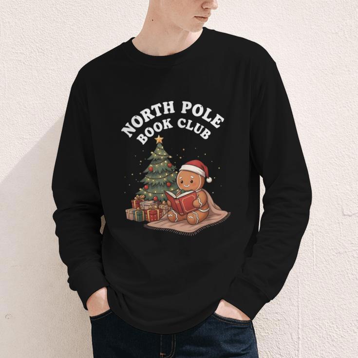 North Pole Book Club Gingerbread Christmas Reading Youth Long Sleeve Tee North Pole Book Club Gingerbread Christmas Reading Youth Long Sleeve Tee