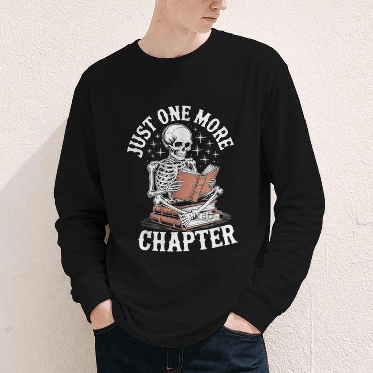 One More Chapter Skeleton Reading Books Lovers Readers Youth Long Sleeve Tee One More Chapter Skeleton Reading Books Lovers Readers Youth Long Sleeve Tee