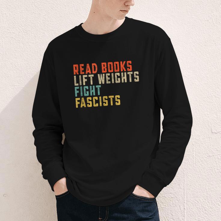 Read Books Lift Weights Fight Fascists Reading Youth Long Sleeve Tee Read Books Lift Weights Fight Fascists Reading Youth Long Sleeve Tee