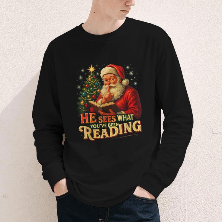 He Sees What You’Ve Been Reading Santa Book Lover Christmas Youth Long Sleeve Tee