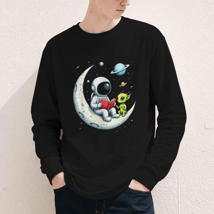 UFO Alien Astronaut Reading Book In Space Youth Long Sleeve Tee