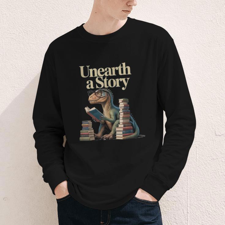 Unearth A Story Dinosaur Reading a Library Book Youth Long Sleeve Tee Unearth A Story Dinosaur Reading a Library Book Youth Long Sleeve Tee