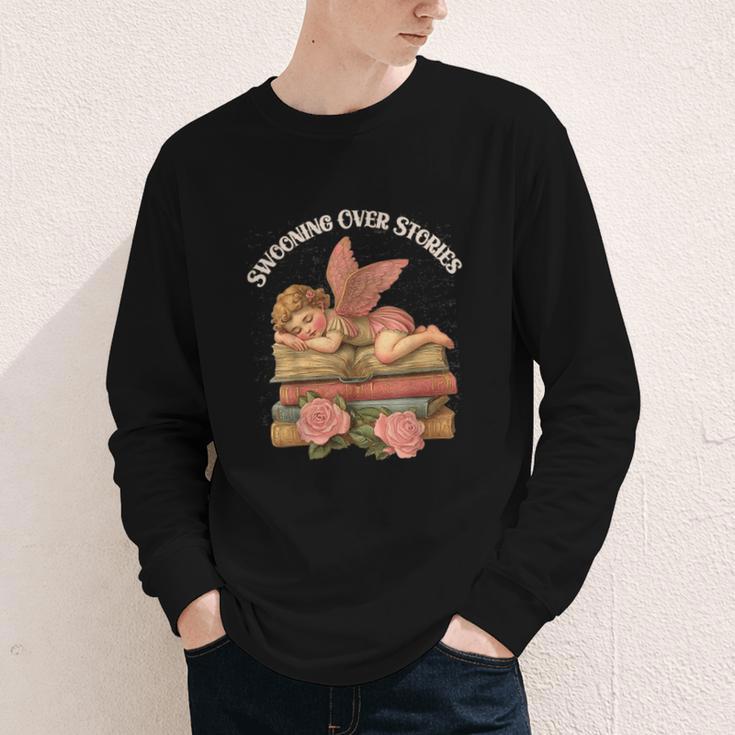 Valentine's Swooning Over Stories Cupid And Book Lover Tee Youth Long Sleeve Tee