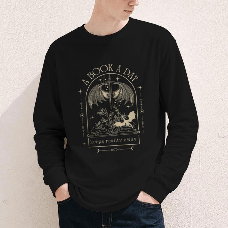 Vintage A Book a Day Keeps Reality Away Spicy Book Readers Youth Long Sleeve Tee