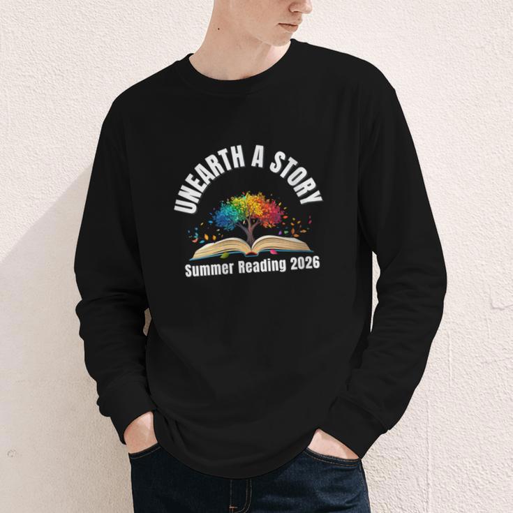 Women's Unearth a Story 2026 Summer Reading Program Tree Book Youth Long Sleeve Tee