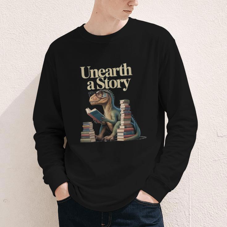 Women's Unearth A Story Dinosaur Reading a Library Book Youth Long Sleeve Tee Women's Unearth A Story Dinosaur Reading a Library Book Youth Long Sleeve Tee