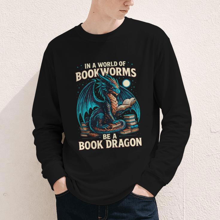 In a World Of Bookworms Be a Book Dragon Reading Youth Long Sleeve Tee