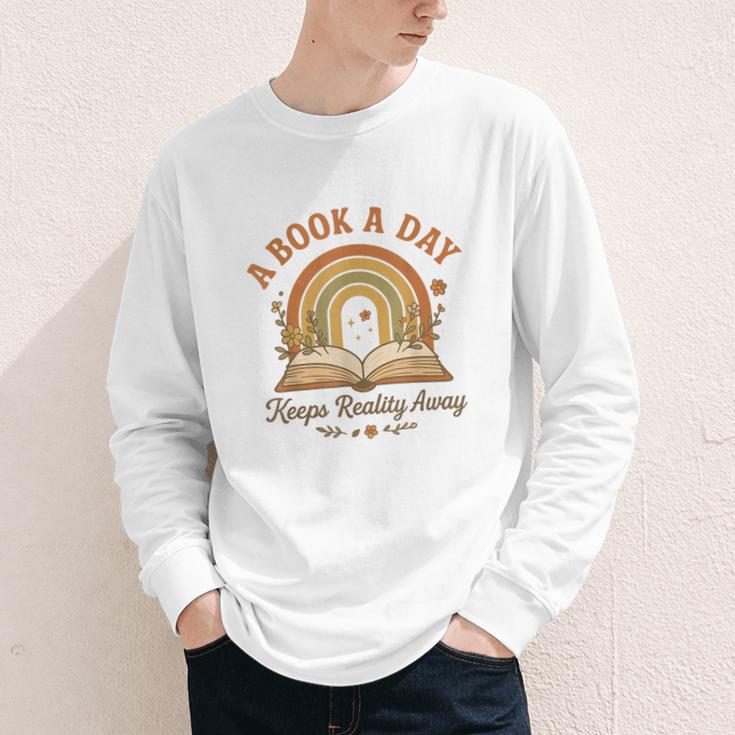 A Book A Day Keeps Reality Away Reading Youth Long Sleeve Tee A Book A Day Keeps Reality Away Reading Youth Long Sleeve Tee
