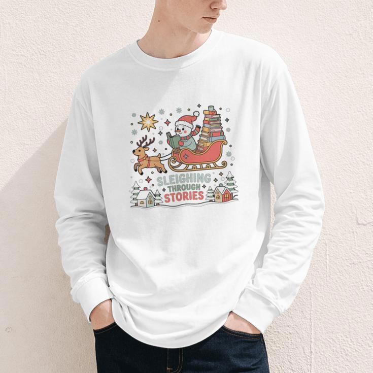 Book Lovers Winter Sleighing Through Stories Tee Premium Tri-Blend Youth Long Sleeve Tee