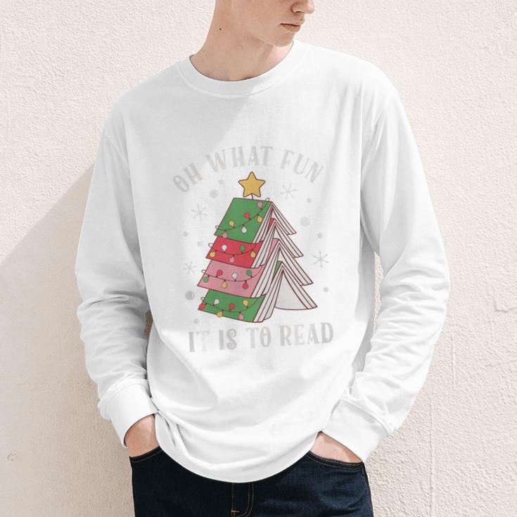 Oh What Fun It Is To Read Book Christmas Tree Premium Tri-Blend Youth Long Sleeve Tee Oh What Fun It Is To Read Book Christmas Tree Premium Tri-Blend Youth Long Sleeve Tee