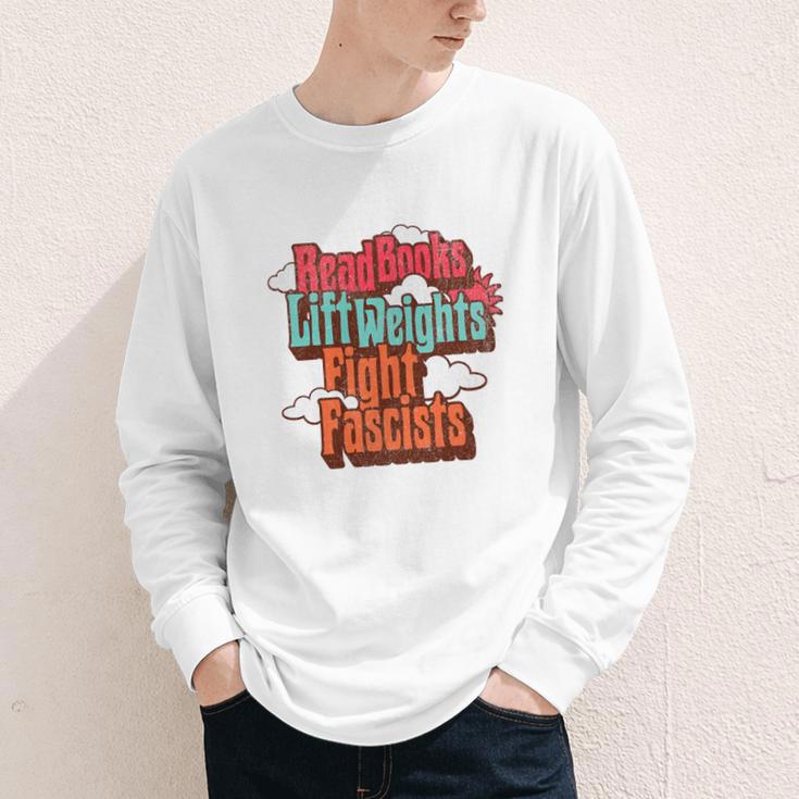 Read Books Lift Weights Fight Fascists Reading No Kings Premium Tri-Blend Youth Long Sleeve Tee Read Books Lift Weights Fight Fascists Reading No Kings Premium Tri-Blend Youth Long Sleeve Tee