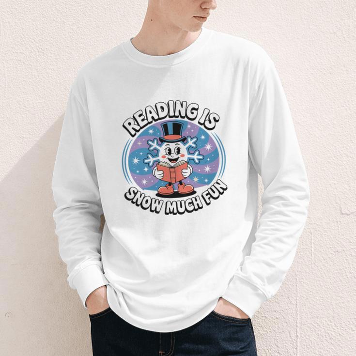 Reading Is Snow Much Fun Snowflake Book Lovers Winter Theme Premium Tri-Blend Youth Long Sleeve Tee