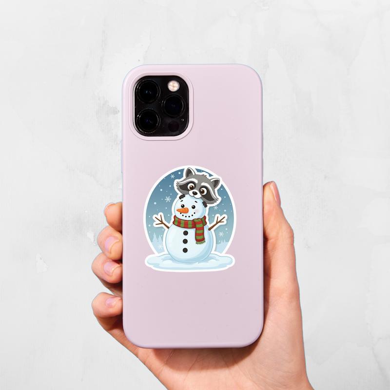 Raccoon Peeker Behind Snowman Sticker Raccoon Peeker Behind Snowman Sticker