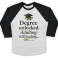Graduation 2025 Degree Unlocked Adulting Still Loading Baseball Raglan Shirt