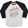 Vintage 1980 Retro Badge Decade Nostalgia Graphic Emblem Premium Tri-Blend Baseball Raglan Shirt