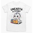 Unearth a Story Cute Dinosaur Summer Reading 2026 Dino Book Unisex T-Shirt