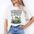 Unearth a Story Frog Reading a Book Summer 2026 Premium Tri-Blend Unisex T-Shirt
