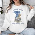A Book A Day Keeps Reality Away Premium Tri-Blend Unisex Sweatshirt